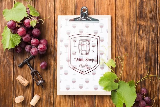 clipboard with organic grape on table