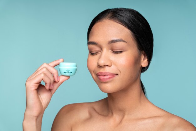 Close up beautiful woman holding container