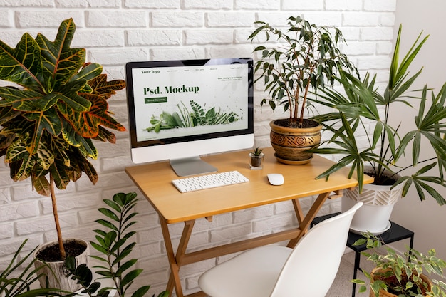 PSD close up on computer mockup surrounded by plants