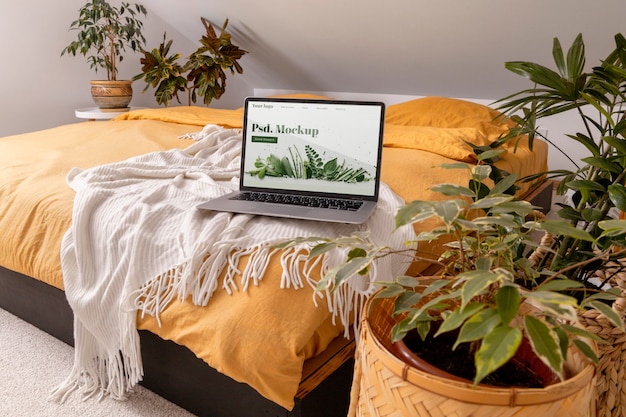 Close up on computer mockup surrounded by plants