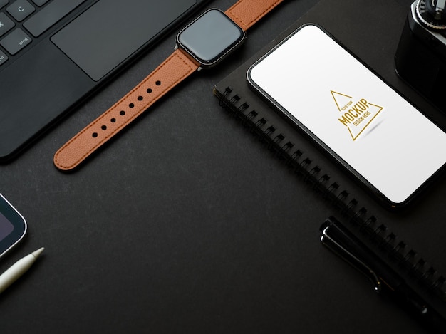 Close up of creative smartphone mockup and accessories