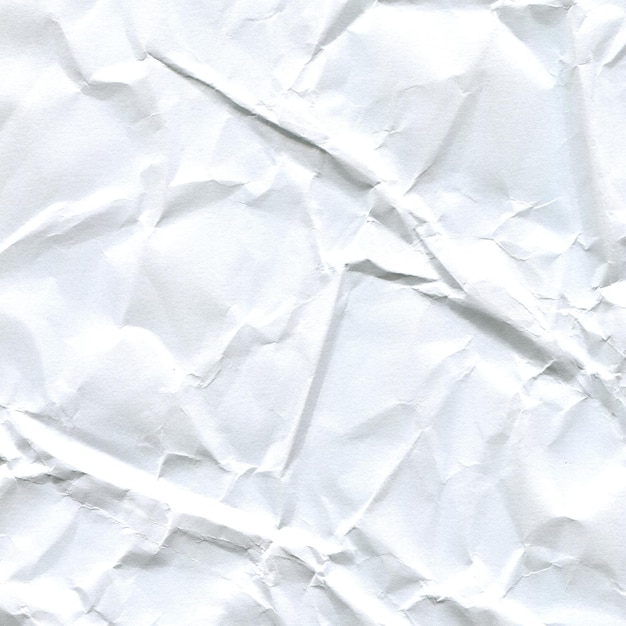 close-up of a crumpled white paper sheet with wrinkles and creases