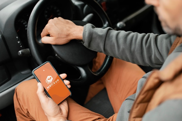 PSD close up delivery man holding smartphone