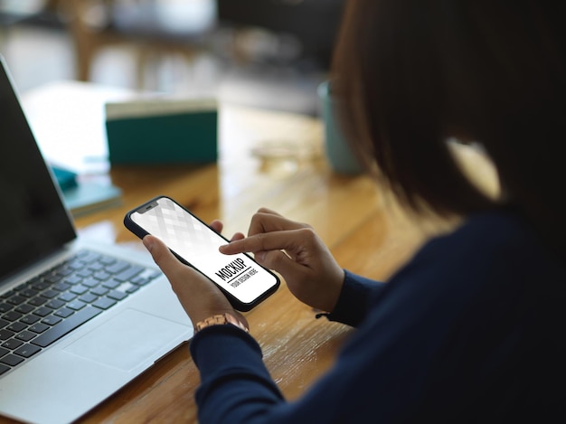 PSD close up of female hands using smartphone mockup