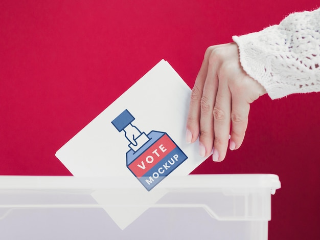 PSD close-up female putting ballot mock-up in box