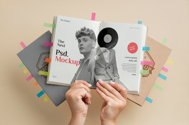 PSD close up hands holding book mockup