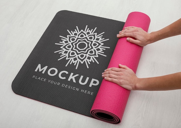 PSD close up hands rolling yoga mat mockup