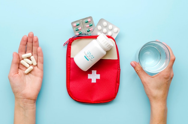 PSD close-up hands with medicine and glass