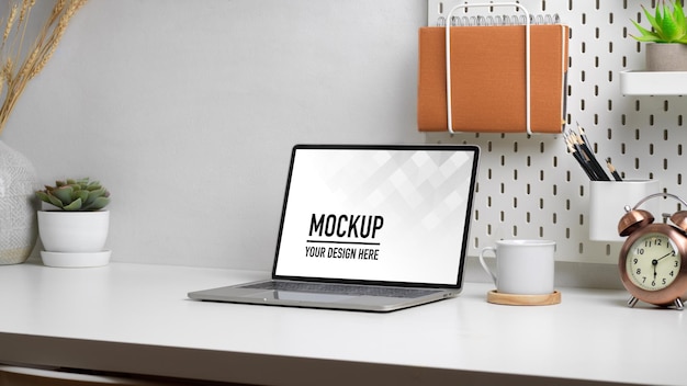 Close up on home office desk with laptop mockup