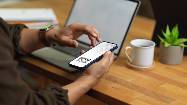 Close up of male hands using smartphone mockup