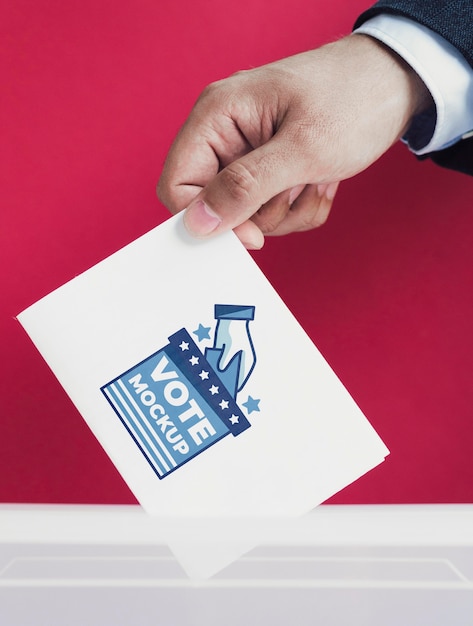 Close-up male putting ballot mock-up in box