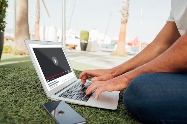 close-up man with laptop and mobile