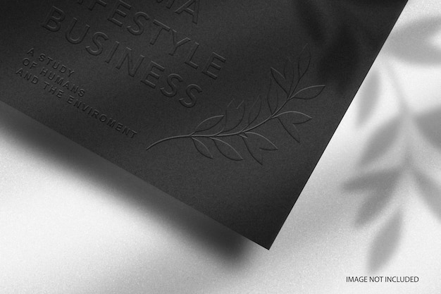 PSD close up minimal black paper embossed logo mockup