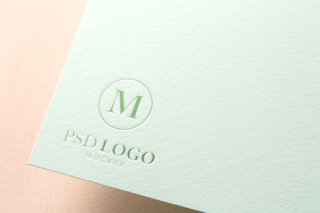 Close-up of paper pressed logo mock-up