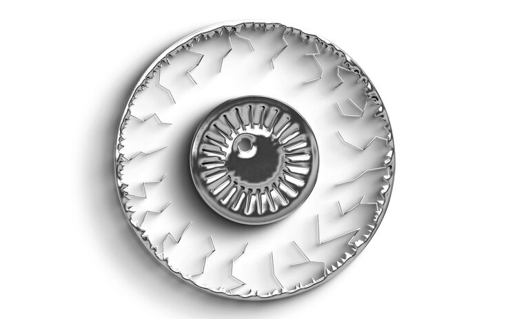 PSD close-up of a silver eye-shaped metal ornament with detailed design
