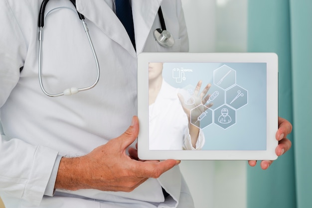 Close-up tablet held by a doctor