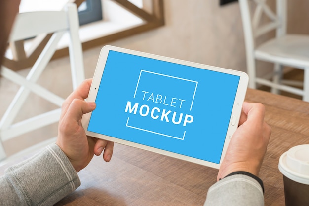 Close up on tablet in man hands mockup