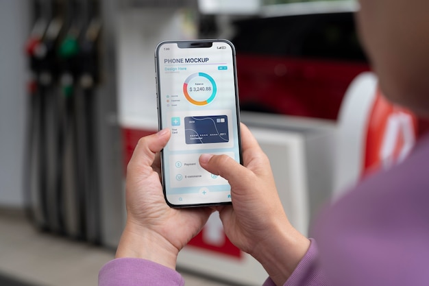 Close-up of touchscreen mock-up on smartphone held by person