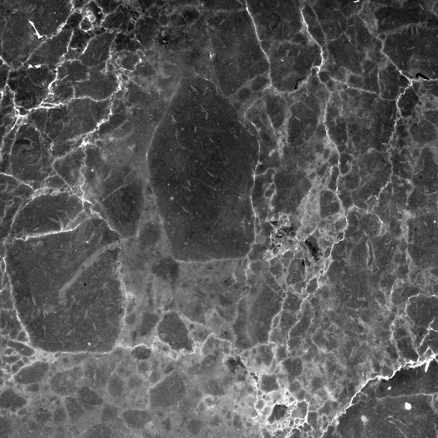 Close-up van een grijs marmeroppervlak met aderen en texturen