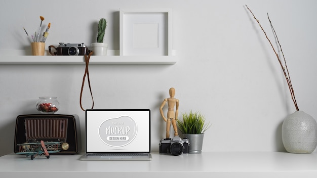 Close up view of contemporary worktable with laptop mockup laptop