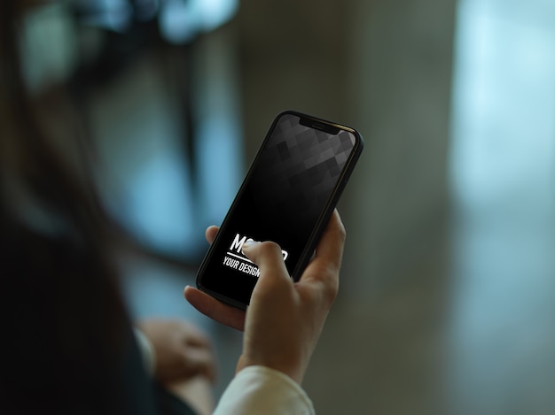 Close up view of female hand using smartphone mockup