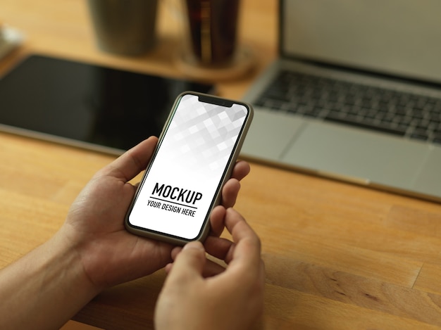 Close up view of hands holding smartphone mockup