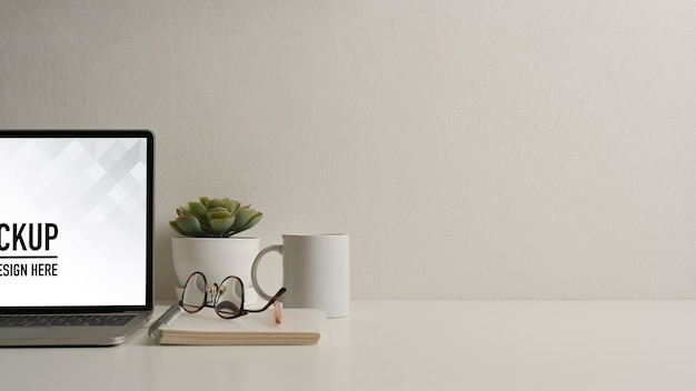 Close up view of home office desk with tablet mockup with keyboard