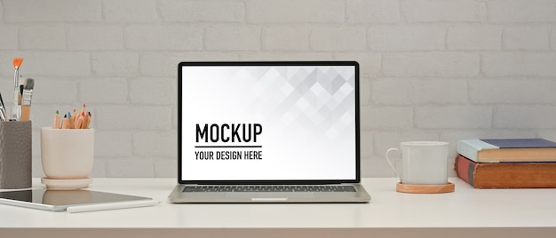 close up view of home office room with laptop mockup