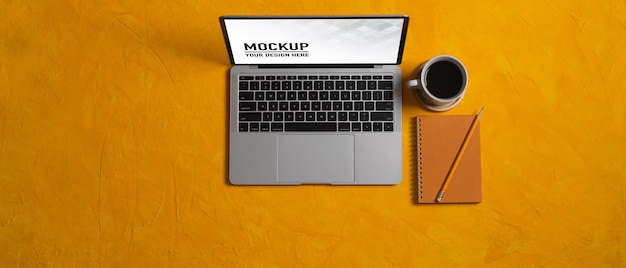 Close up view of workspace with laptop mockup in home office
