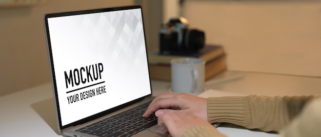 Close up view of workspace with laptop mockup in home office room