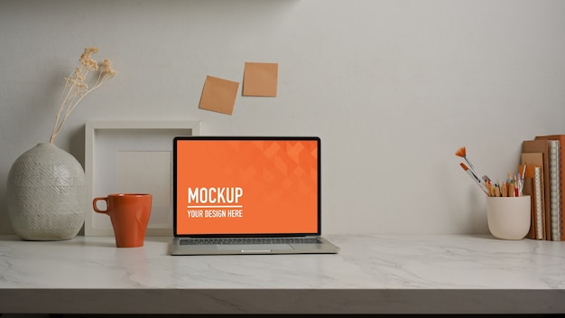 Close up view of worktable with laptop mockup