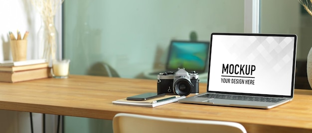 Close up view of worktable with laptop mockup