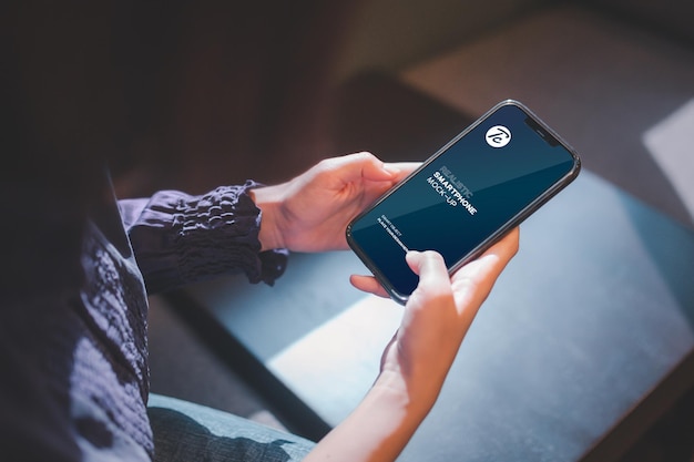 PSD close up of woman using smartphone in cafe