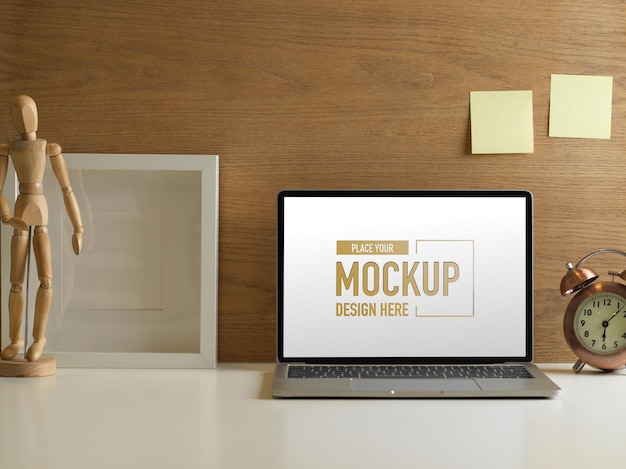 Close up of workspace with laptop mockup and decorations in home office room