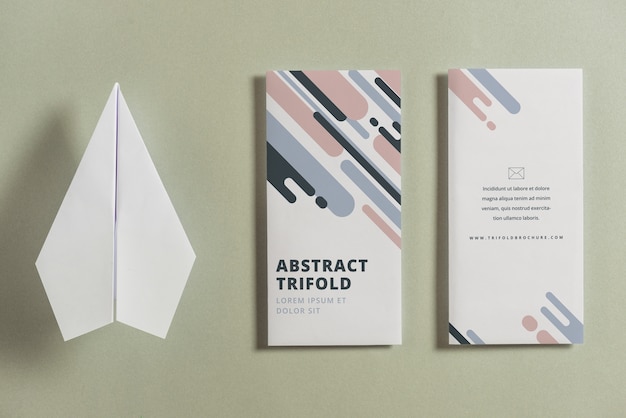 Closed trifold brochure mockup with paper plane