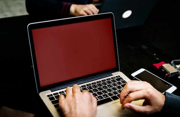 PSD closeup of hand with computer laptop background