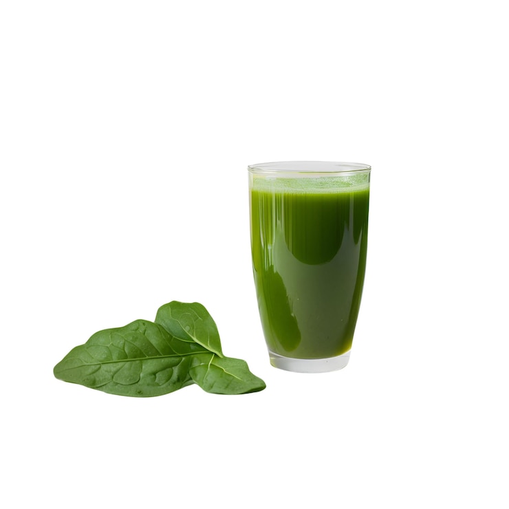 closeup of a SpinachKaleApple Juice on a white backdrop