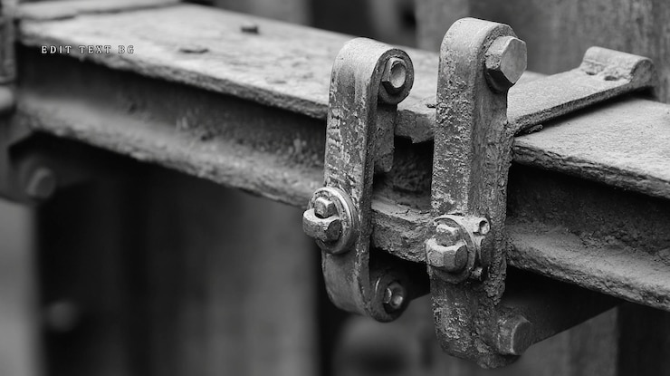 PSD closeup of rusty weathered metal industrial machinery component with bolts and fasteners