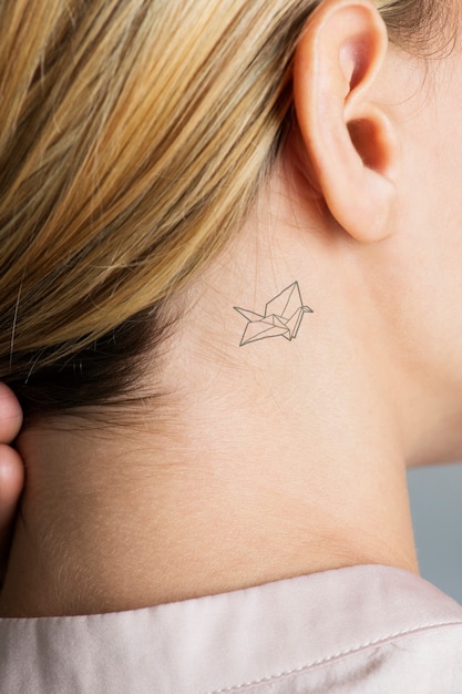 PSD closeup of a simple behind the ear tattoo of a young woman