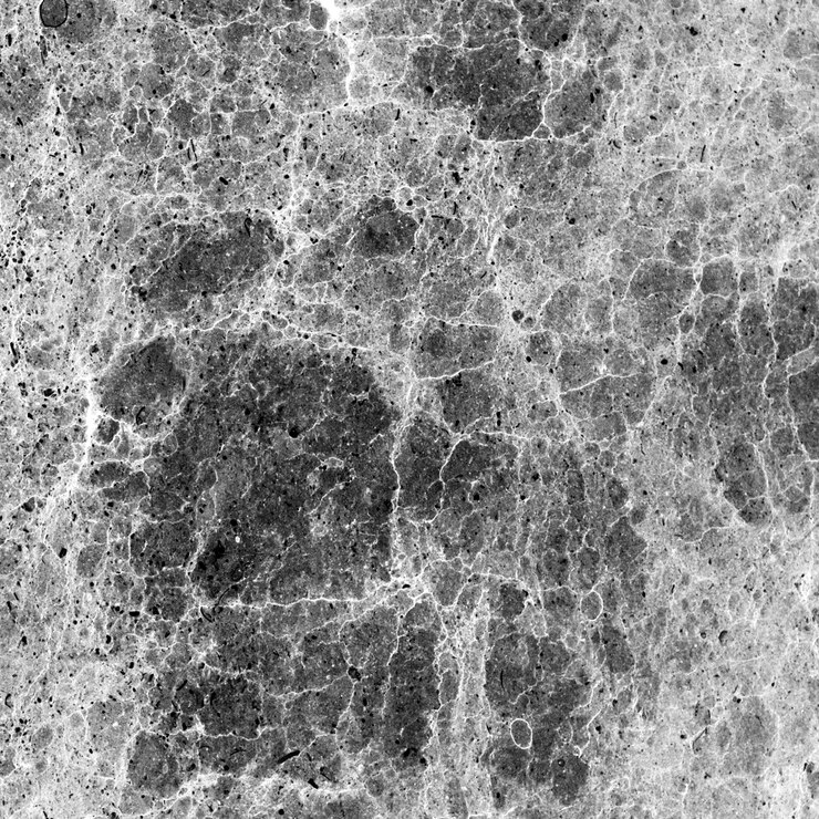 PSD closeup of a weathered stone surface with cracks and uneven texture
