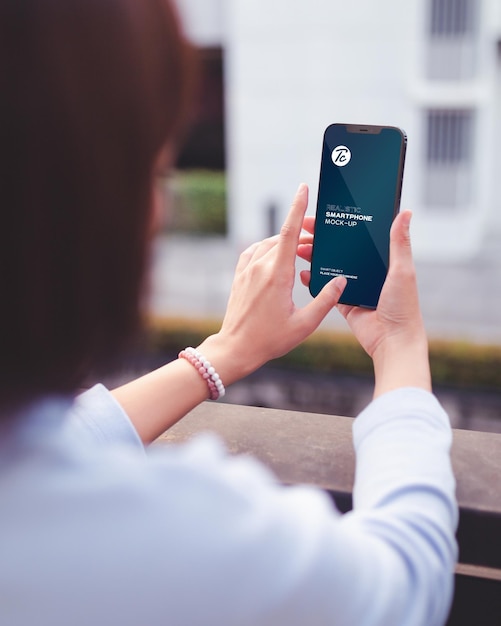 PSD closeup of woman using smartphone mockup