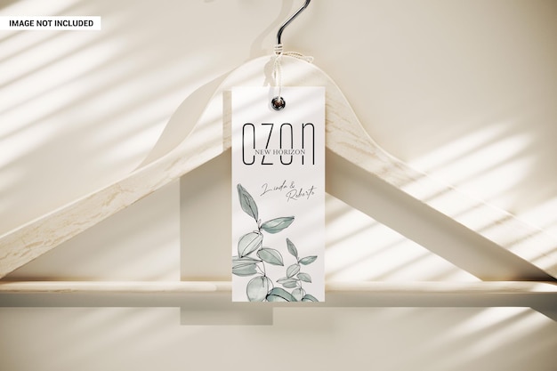 PSD clothes tag hanging on the wooden hanger mockup