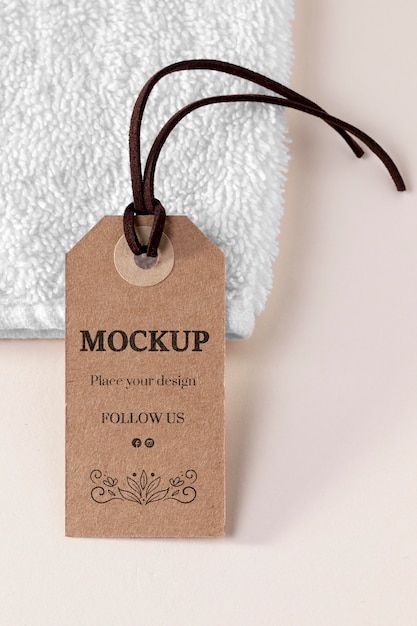 PSD clothing mock-up tag and white towel