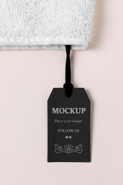 PSD clothing mock-up tag and white towel