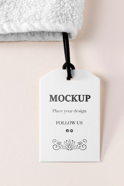 Clothing mock-up tag with thread on towel