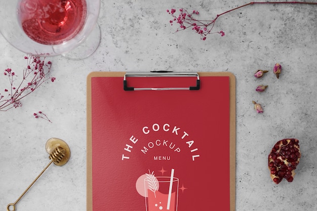 Cocktail flyer and drinks arrangement flat lay