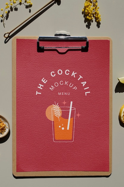Cocktail flyer and plants arrangement flat lay
