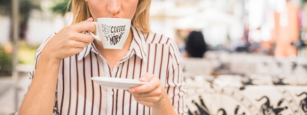 PSD coffee cup mockup with woman