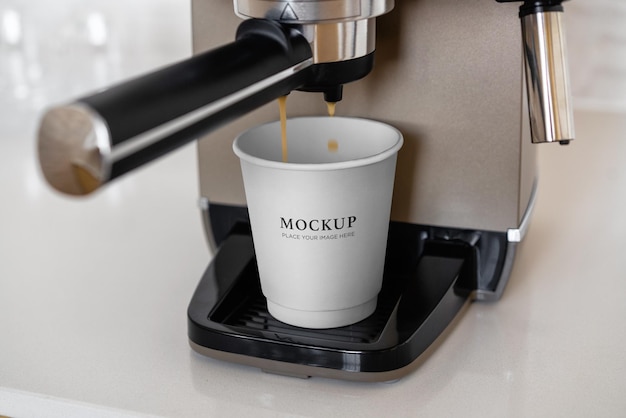 Coffee paper cup mockup in coffee machine