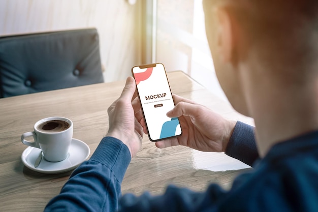 Coffee shop phone mockup in man hand